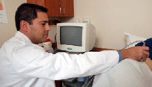 Dr. Kurzer examines a patient